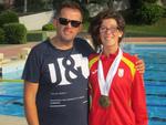 Marian Polo, amb les 4 medalles d'or, i el seu entrenador, Carlos Santos